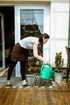 worker watering a clients plants