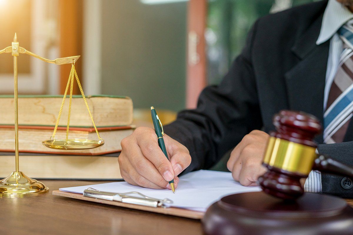 Lawyer Working on Wooden Desk with Gavel and Justice Law — Douglasville, GA — Don F. DeFoor P.C.