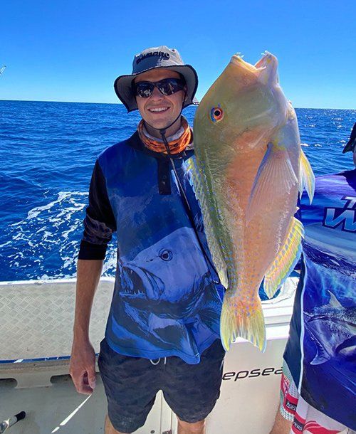 Man Caught a Big Parrot Fish from a Fishing Charters on the Sunshine Coast Deep Sea
