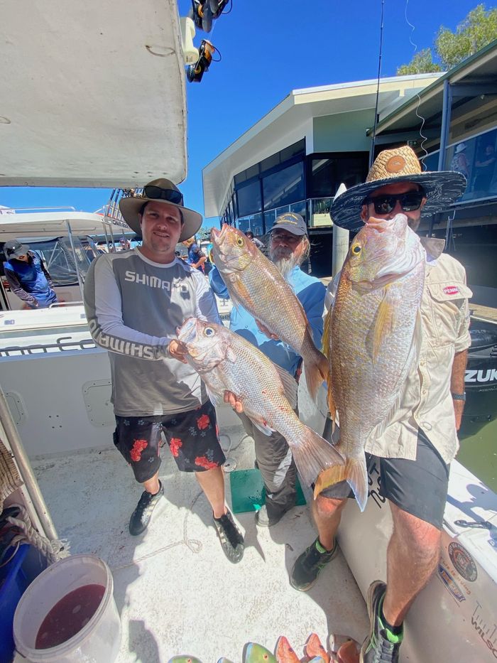 Two Fisherman Holding Cobia during a Deep Sea Fishing Charter in the Sunshine Coast — Deep Sea Fishing Co Sunshine Coast In Noosa Queensland