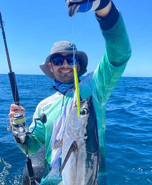 Fisherman Happily Large Fish From  Fishing Charters Sunshine Coast