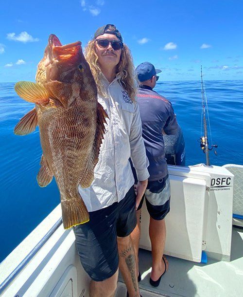 Holding Greasy Grouper on the Charter Yacht | Fishing Charters Sunshine Coast 