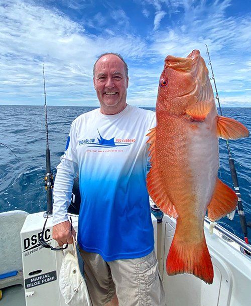Holding Coral Trout Fish on the Yacht | Fishing Charters Sunshine Coast