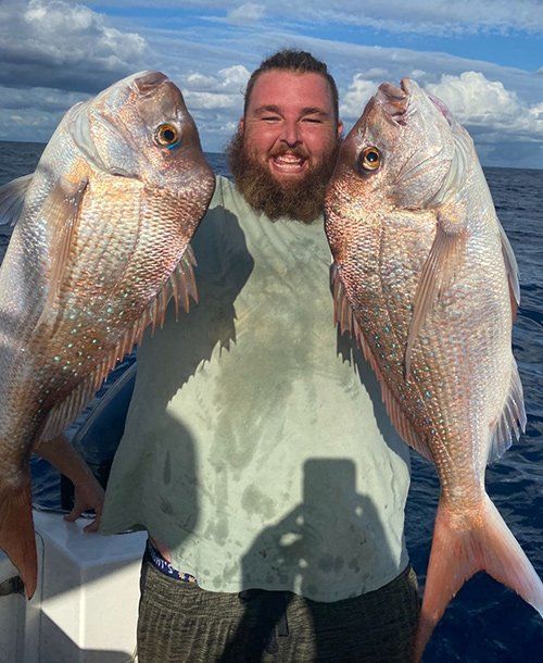 Holding Two Fresh Double Snapper Fish  Caught | Fishing Charters Sunshine Coast 