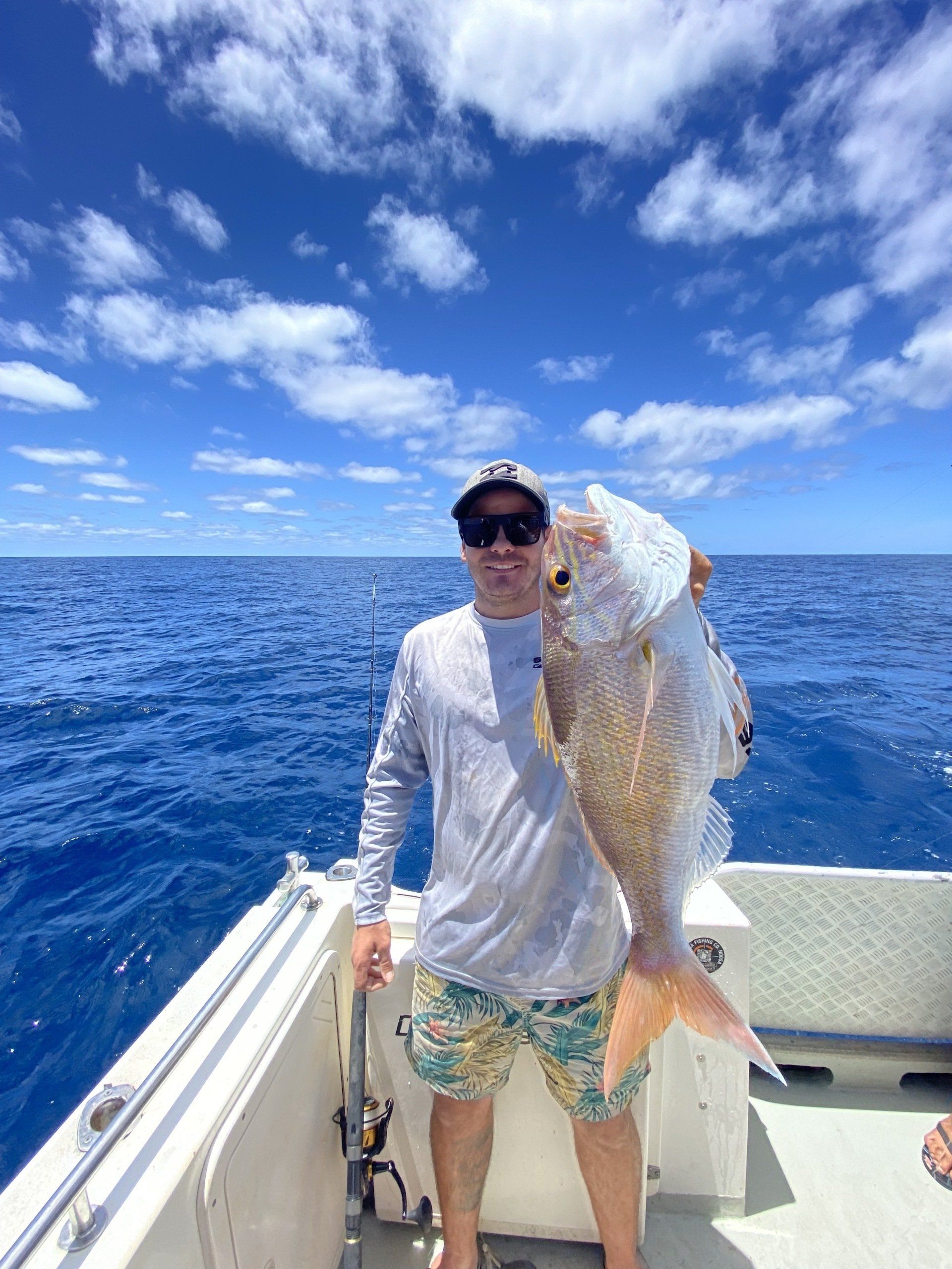 Man Holding His Deep Sea Fishing Catch — Deep Sea Fishing Co Sunshine Coast In Noosaville Queensland