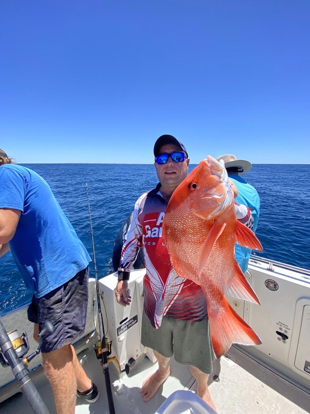 Man Holding A Red Emperor Fish