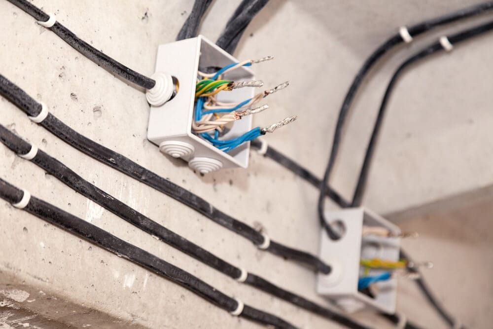 A Bunch of Wires Are Connected to a Wall — Sawtell Electrical Pty Ltd In Woolgoolga, NSW