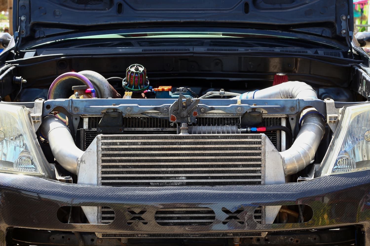 A Close Up of a Car Engine With the Hood Open — Gricey's Workshop Automotive Specialist in West Wodonga, VIC