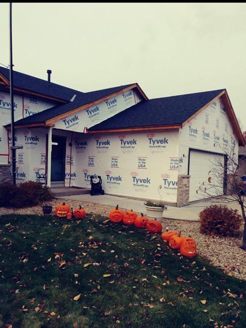 A house is being built with tyvek insulation