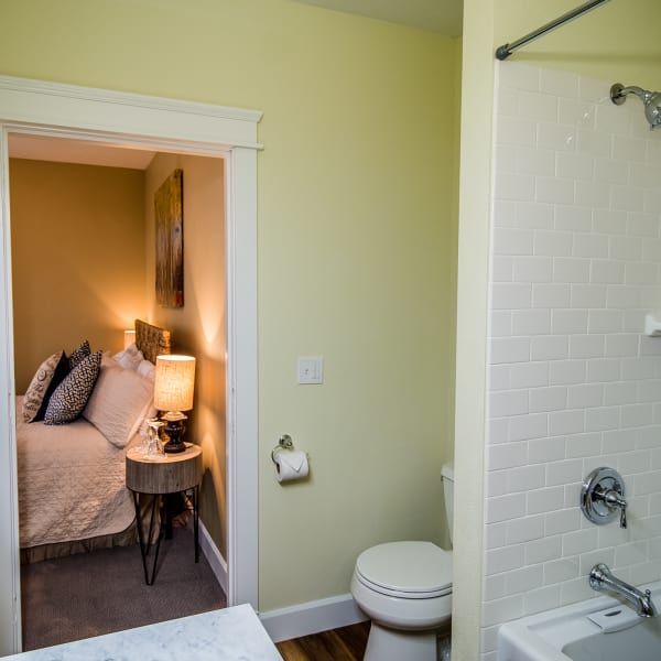 A bathroom with a toilet a sink and a bathtub