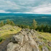 A view of a valley from the top of a mountain.