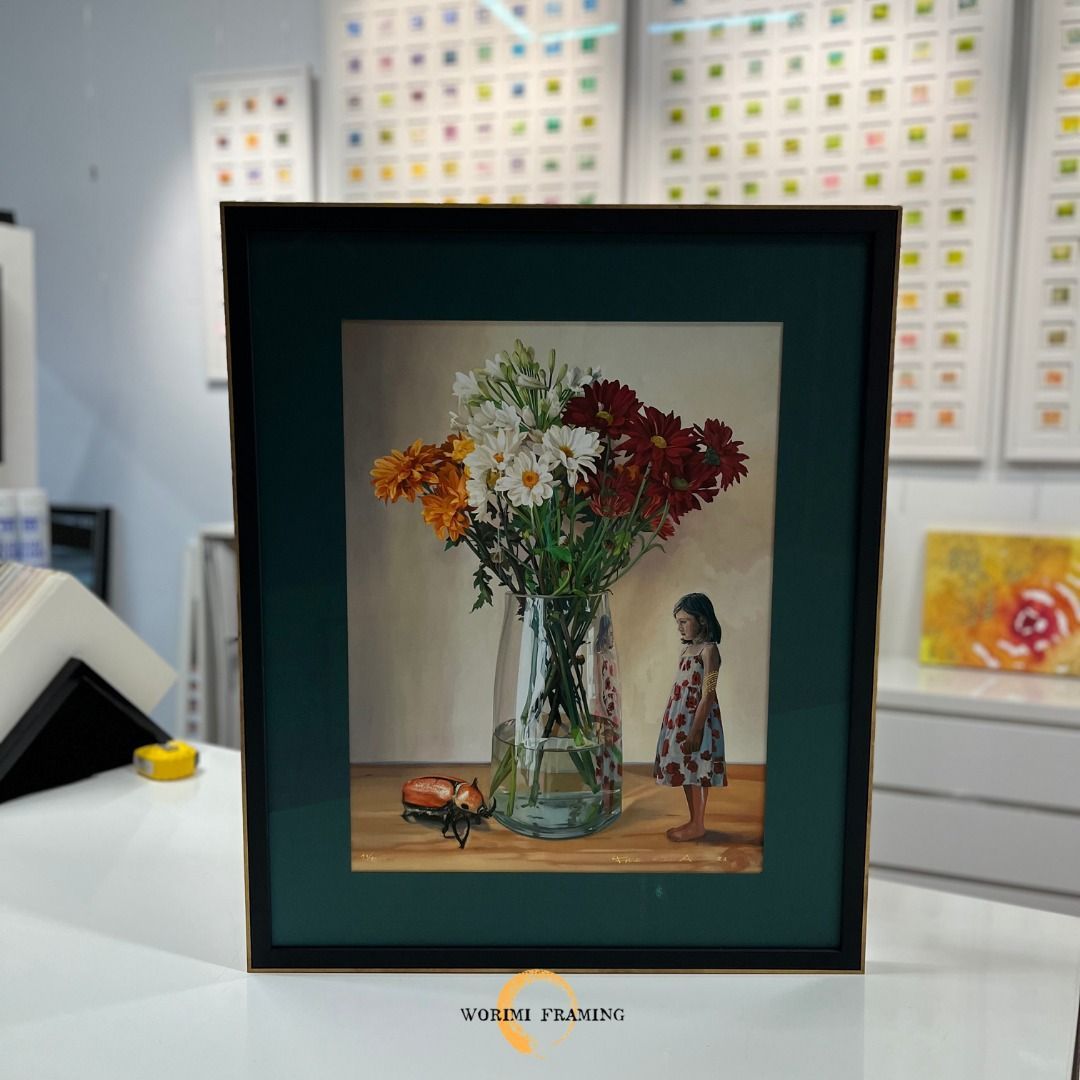 A Framed Picture Of A Girl Standing Next To A Vase Of Flowers — Worimi Framing Service In Maitland, NSW