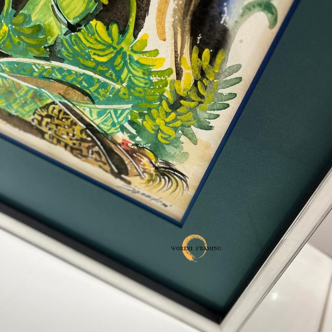 A Close Up Of A Framed Painting With A White Frame — Worimi Framing Service In Lake Macquarie, NSW