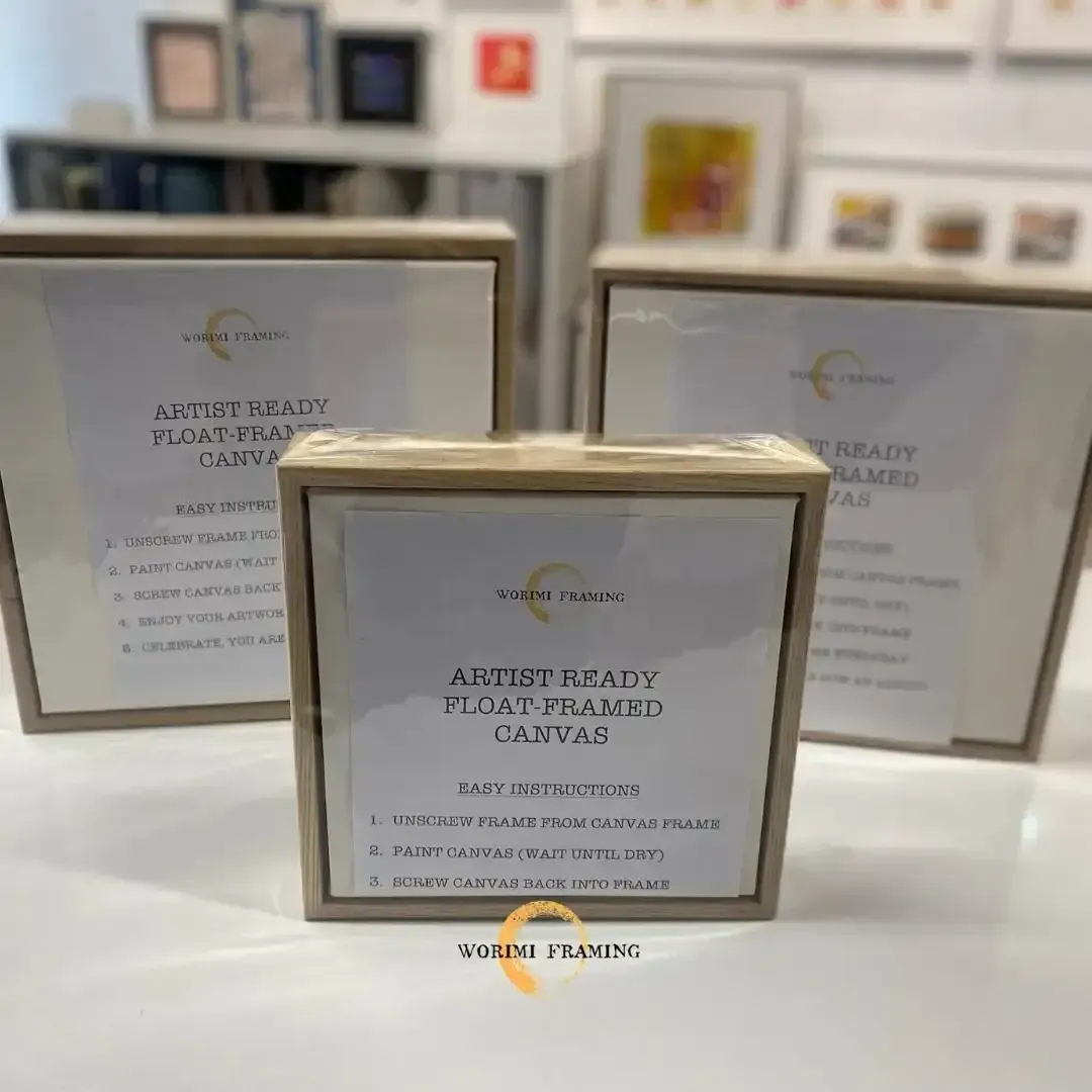 Three Picture Frames Are Sitting On A Table — Worimi Framing Service In Newcastle, NSW