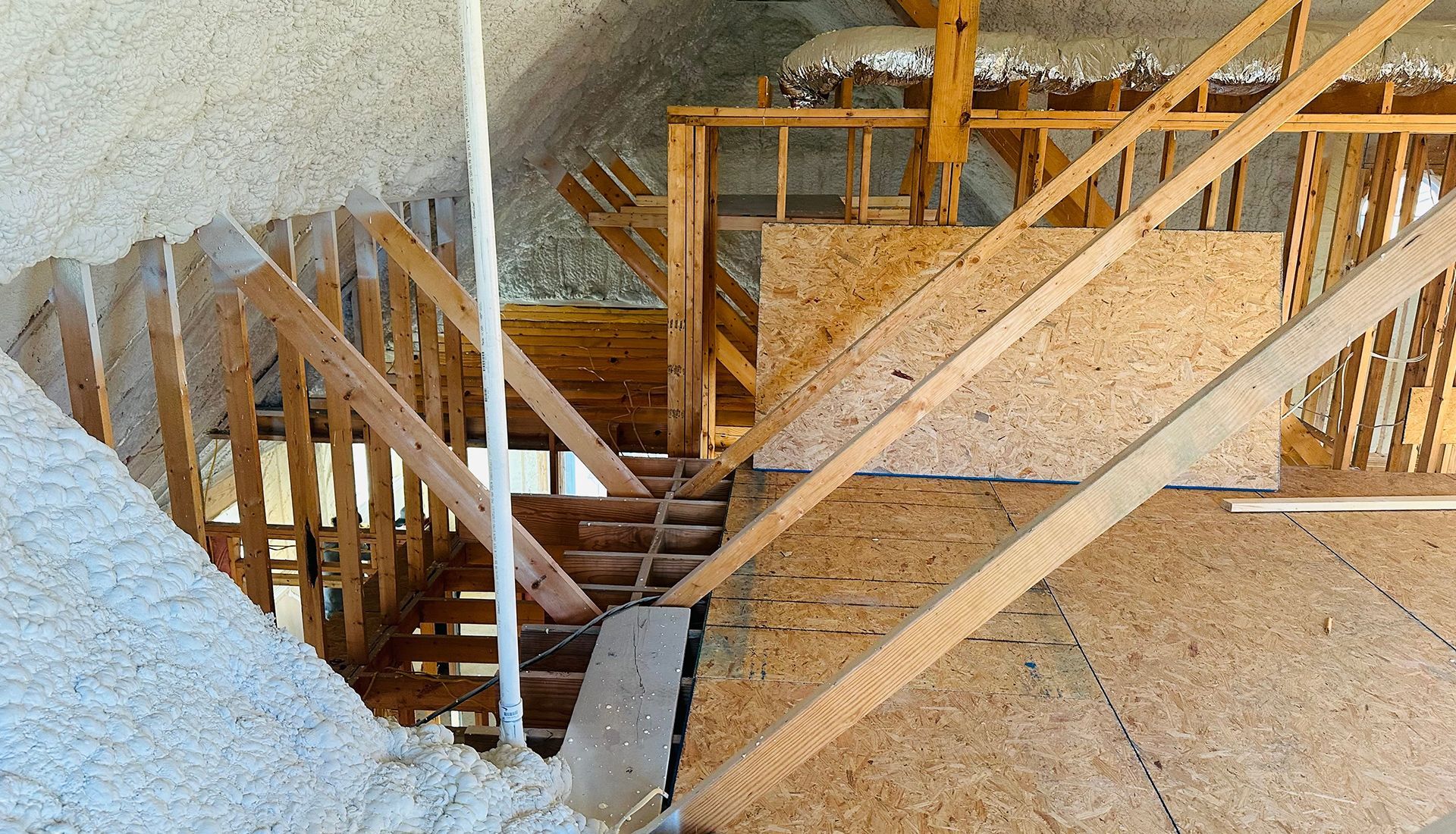 A staircase is being built in the attic of a house