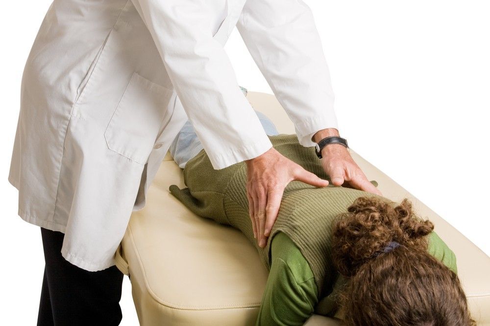 A Woman is on a Table Getting a Massage — Mark O'Brien Chiropractic in West End, QLD