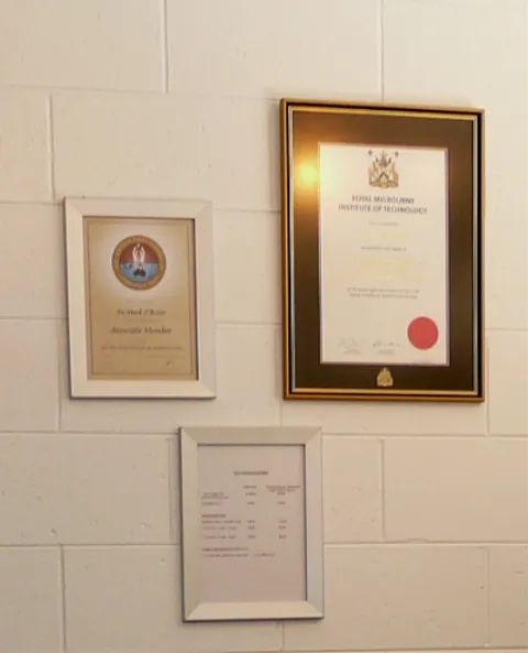 Three Framed Certificates Are Hanging on a White Wall — Mark O'Brien Chiropractic in West End, QLD
