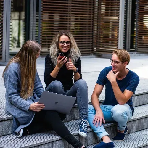 A group of people are sitting on steps — Mark O'Brien Chiropractic in West End, QLD