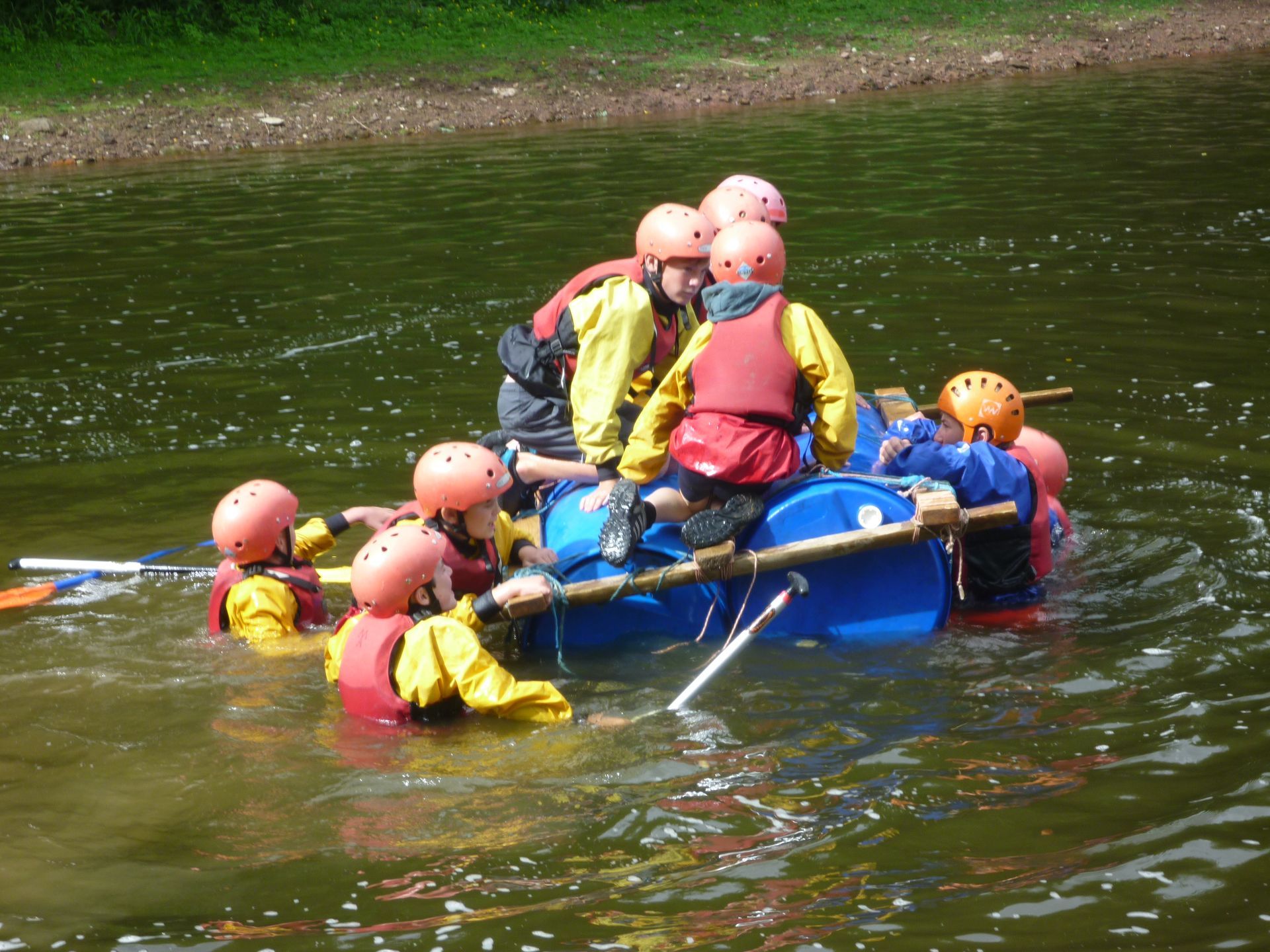 A group of people are in a raft in the water
