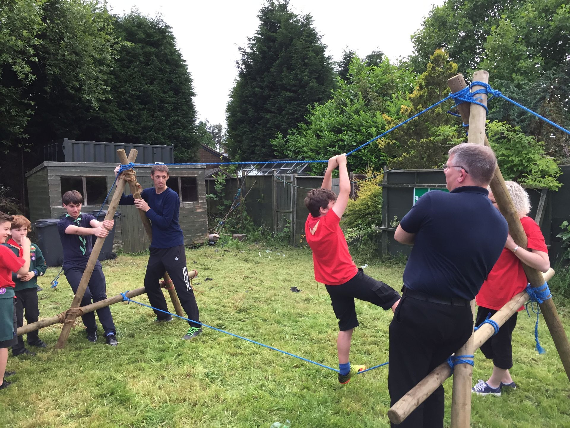 A group of people are playing a game in a field.