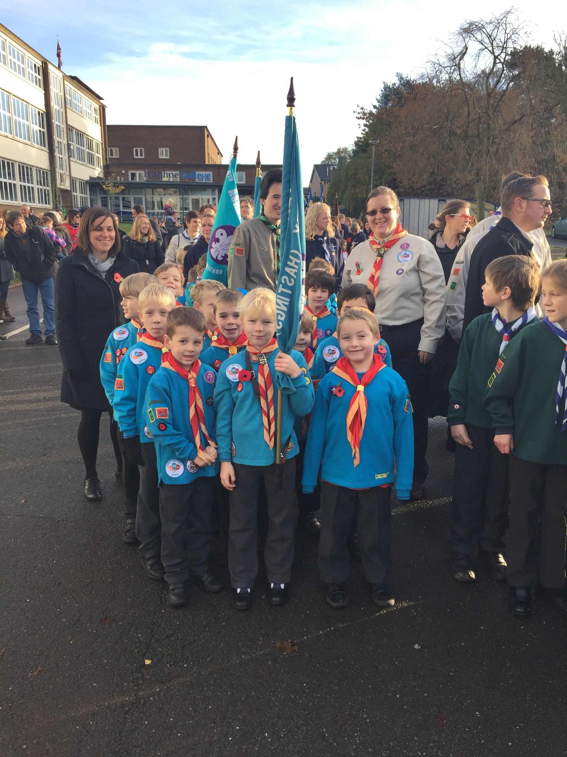 A group of boy scouts are posing for a picture