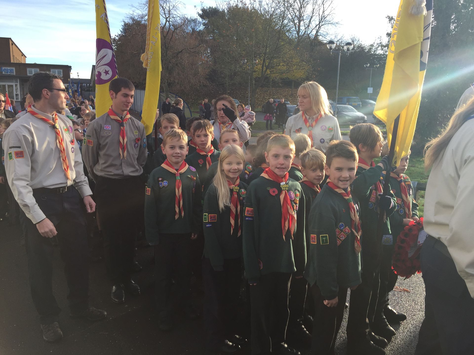 A group of boy scouts are standing in a line