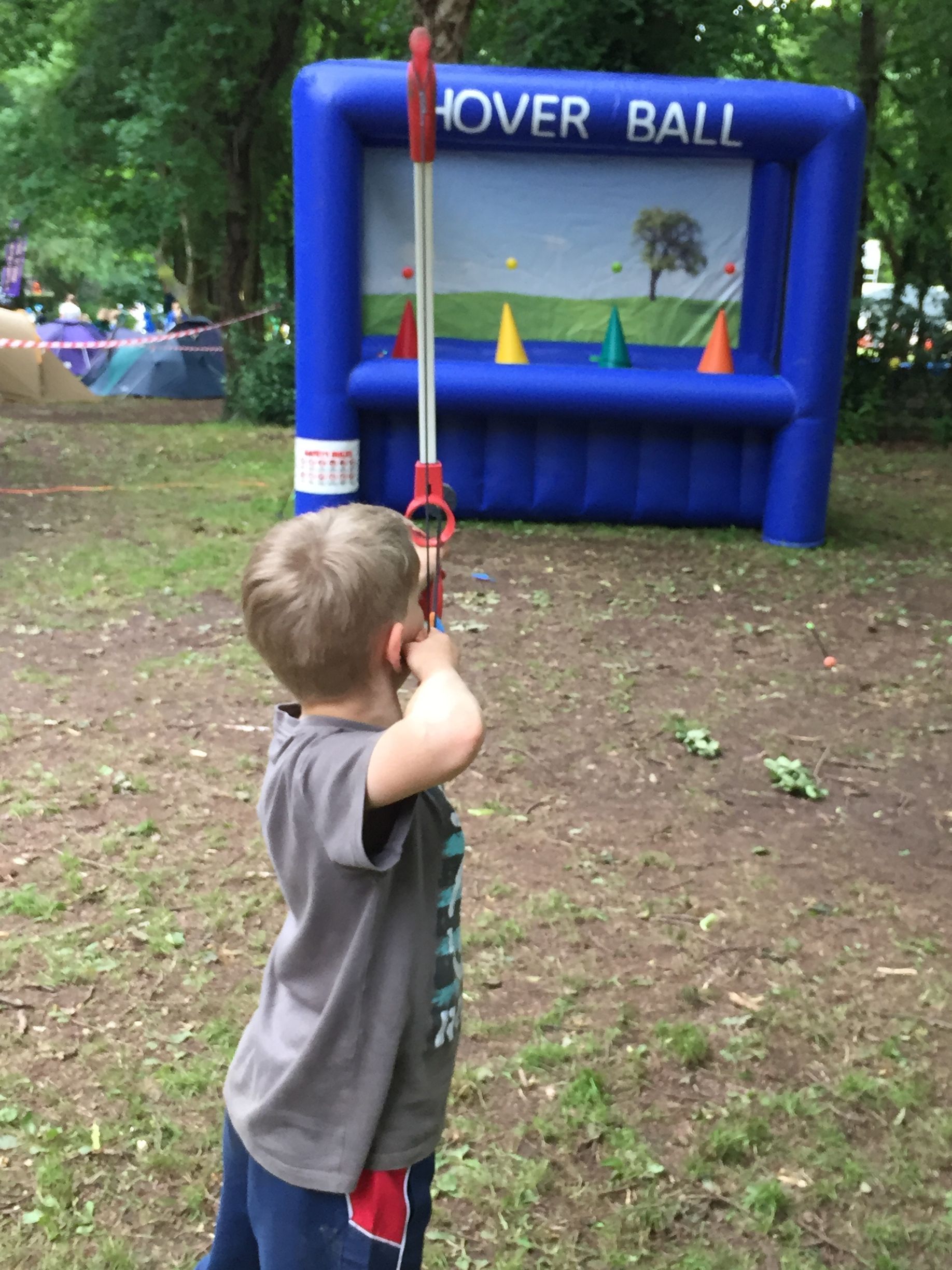 A young boy is playing a game called hover ball