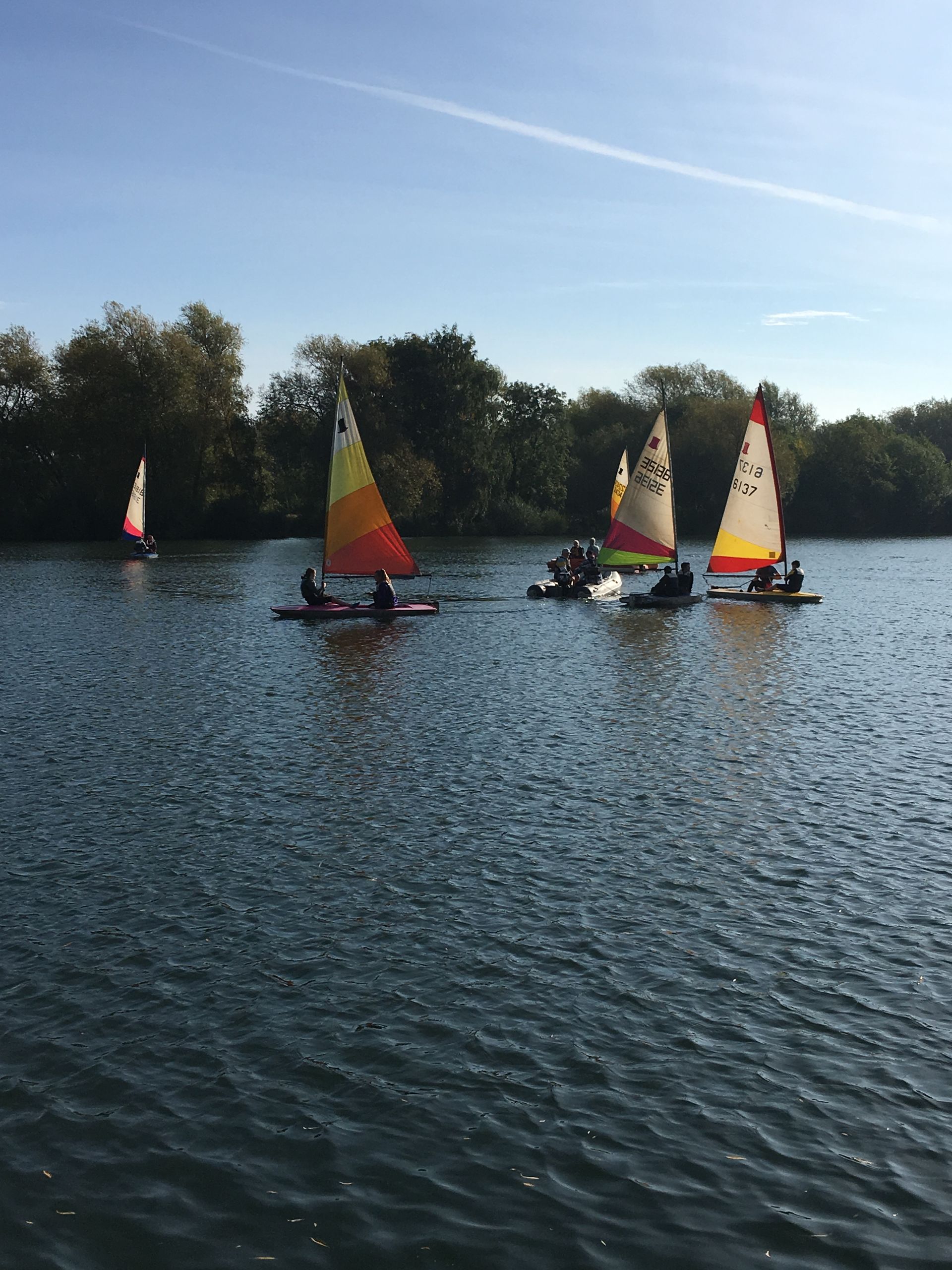A group of people are sailing on a lake.