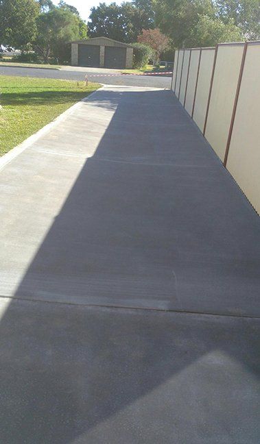 Concrete smoother being used — Concrete Driveways in Toowoomba, QLD