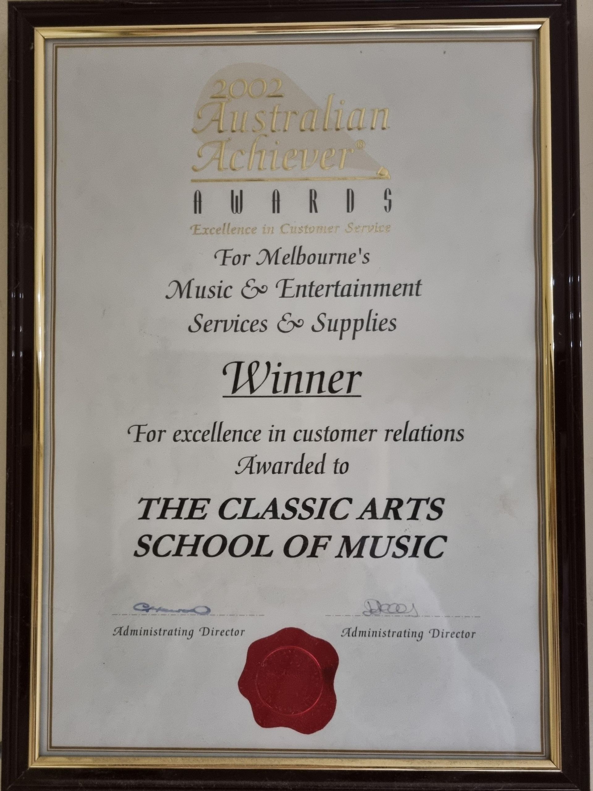 Framed award certificate for The Classic Arts School of Music. It's a winner for excellence in customer relations, from the Australian Achievers Awards.