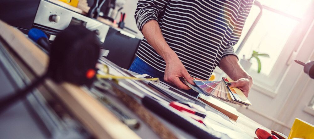 Two paint rollers are sitting on a wooden table. — Capital Ultimate Facility in Beard, ACT