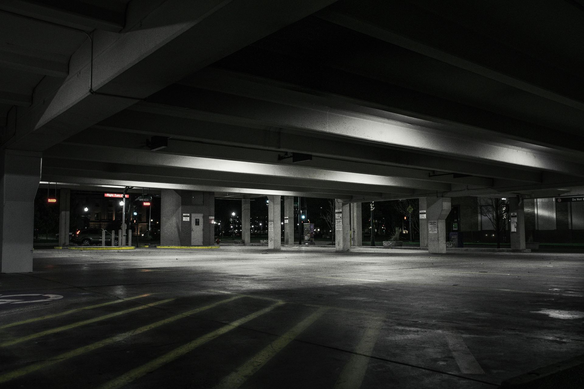 A black and white photo of an empty parking garage at night. — Capital Ultimate Facility in Canberra, ACT