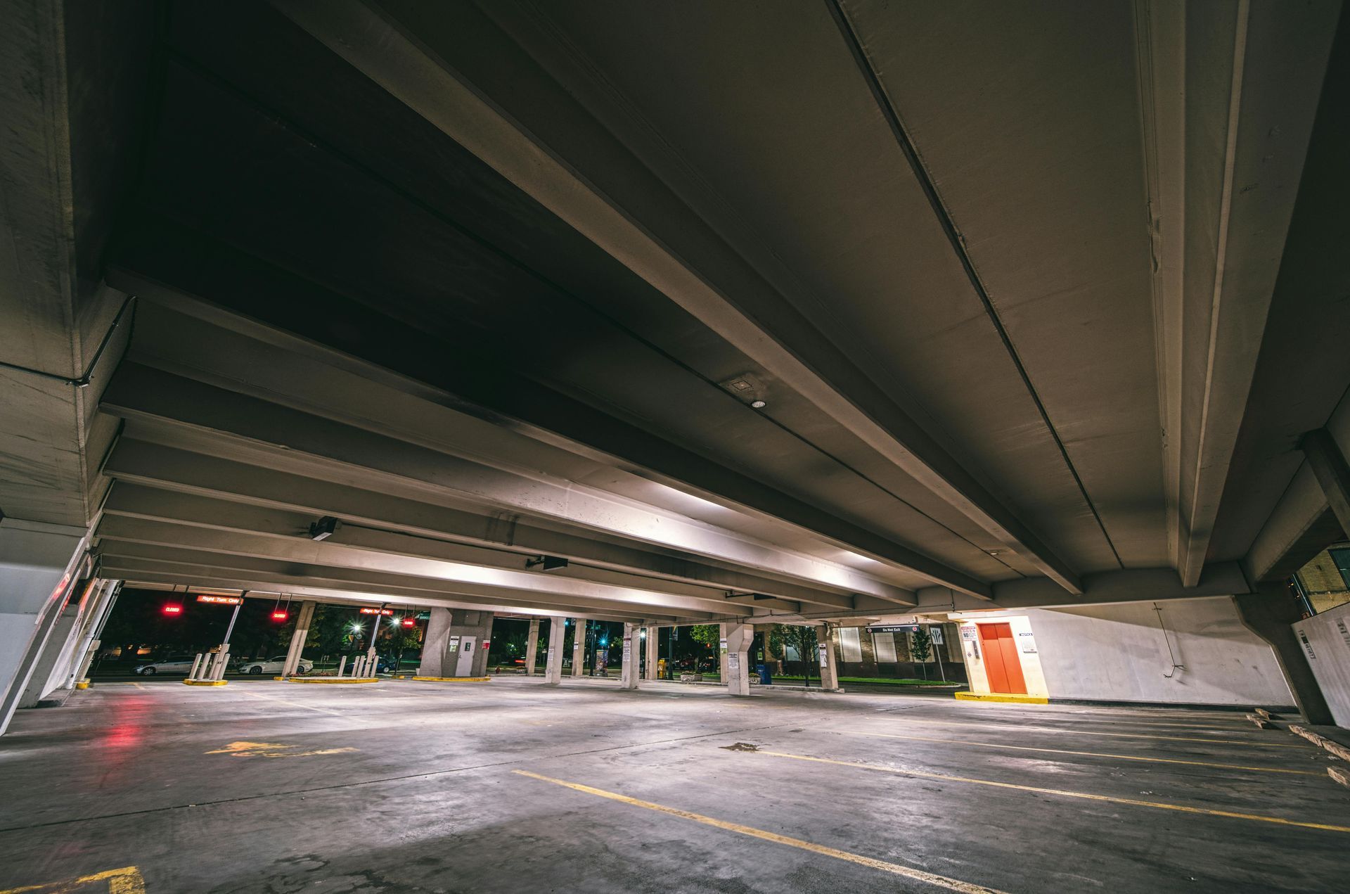 The inside of an empty parking garage at night. — Capital Ultimate Facility in Tuggeranong, ACT