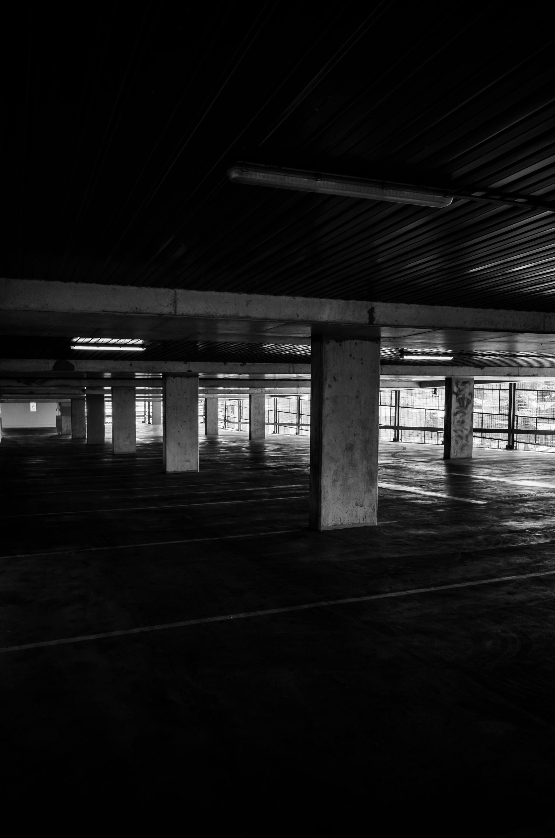 A black and white photo of an empty parking garage at night. — Capital Ultimate Facility in Gungahlin, ACT