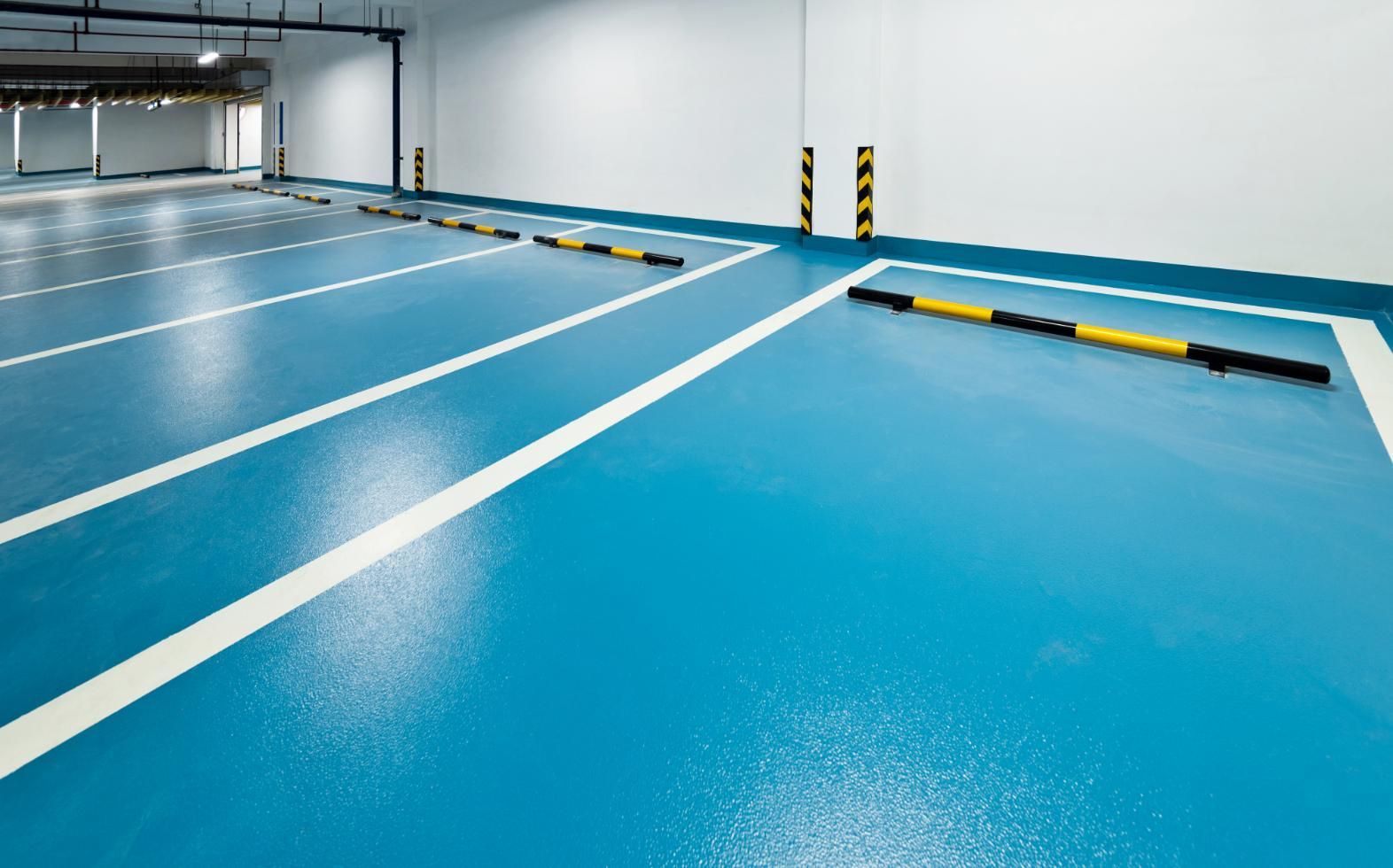 Parking Garage With a Blue Floor and White Lines — Capital Ultimate Facility in Tuggeranong, ACT
