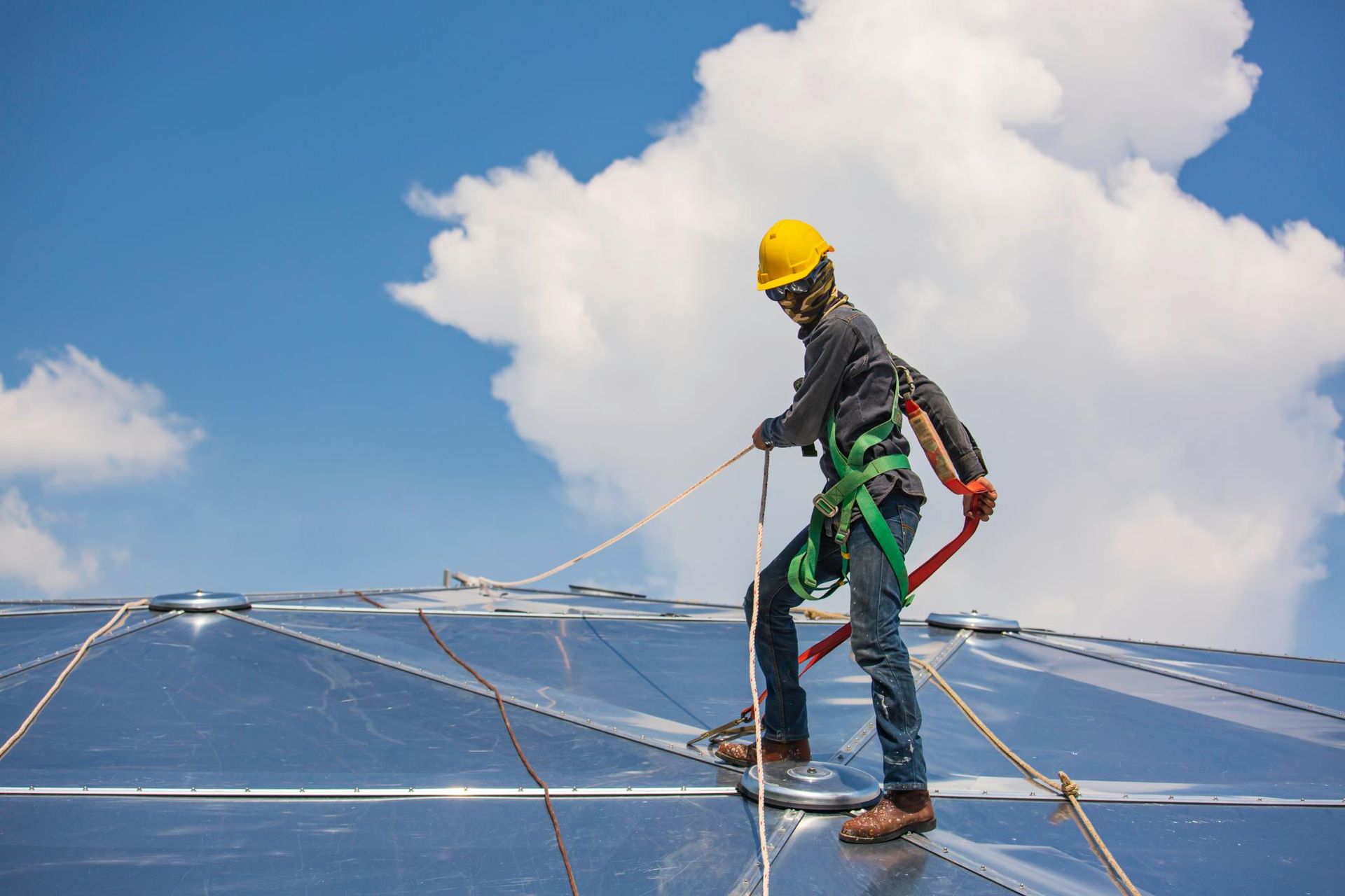 Construction Worker is Standing on Top of a Clear Plastic Roof — Capital Ultimate Facility in Gungahlin, ACT