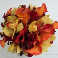 Orange, yellow, and red floral bouquet with roses and calla lilies