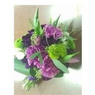 Purple and green floral bouquet with white accents on a light background