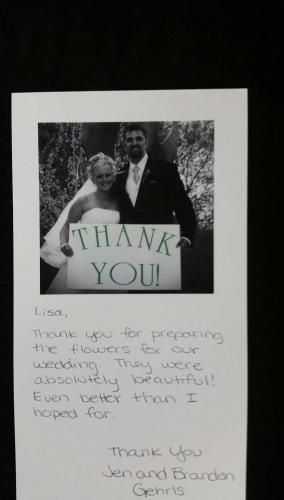 Black-and-white thank-you card with a man holding a “THANK YOU!” sign and handwritten message below.