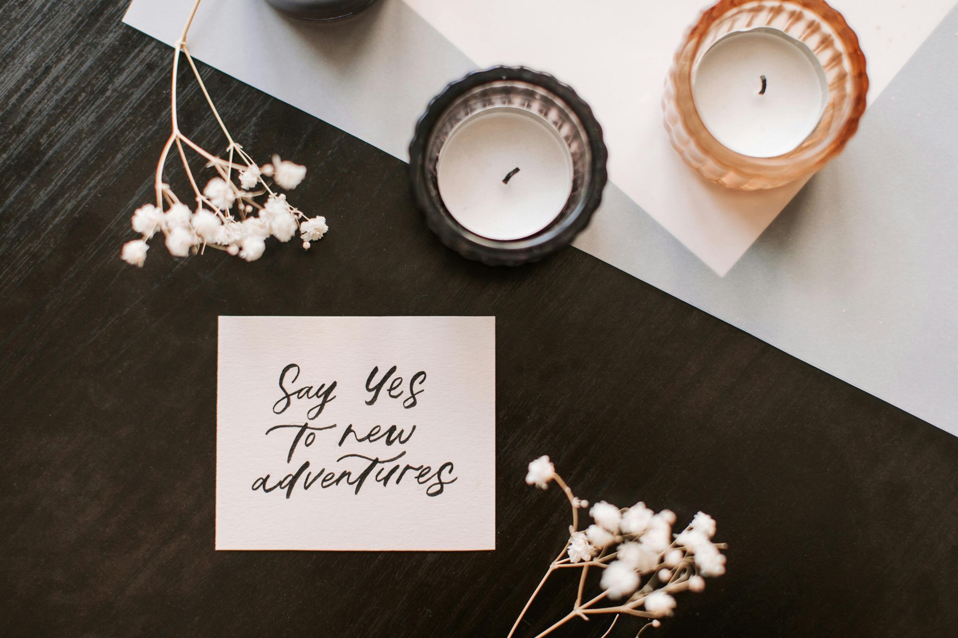 A note on a table that says say yes to new adventures