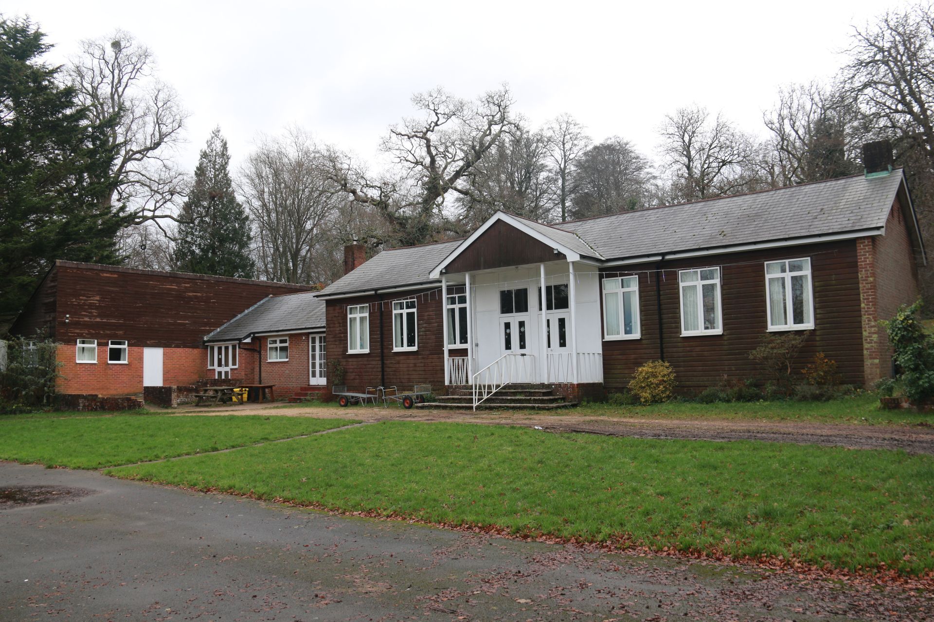 Image of a one storey barn style building with modern accommodation attached.