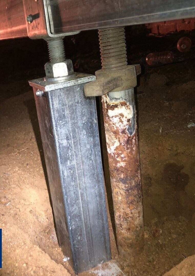 A Close Up Of A Rusty Metal Post In A Basement — Affordable Underpinning Solutions In Shell Cove, NSW