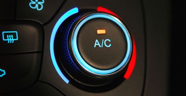 Up close to A/C knob on vehicle dashboard | Olmsted Auto Care