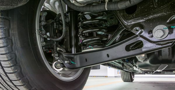 Up close of suspensions shown beneath vehicle | Olmsted Auto Care