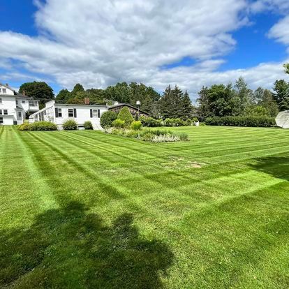 NEK Tree Workz after photo of a freshly mowed lawn