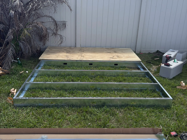 Custom metal platform frame and plywood paneling built by AA SmartWired