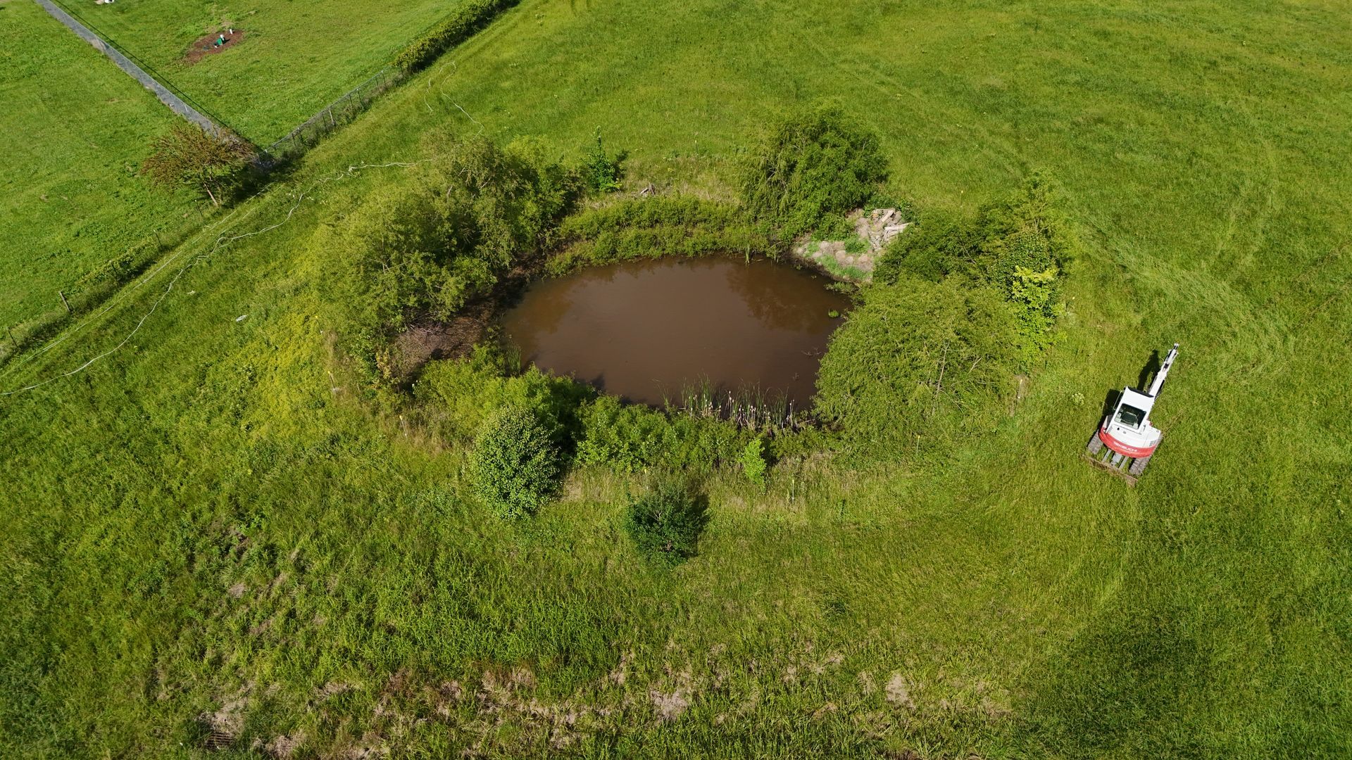 An excavator is moving dirt on a construction site.