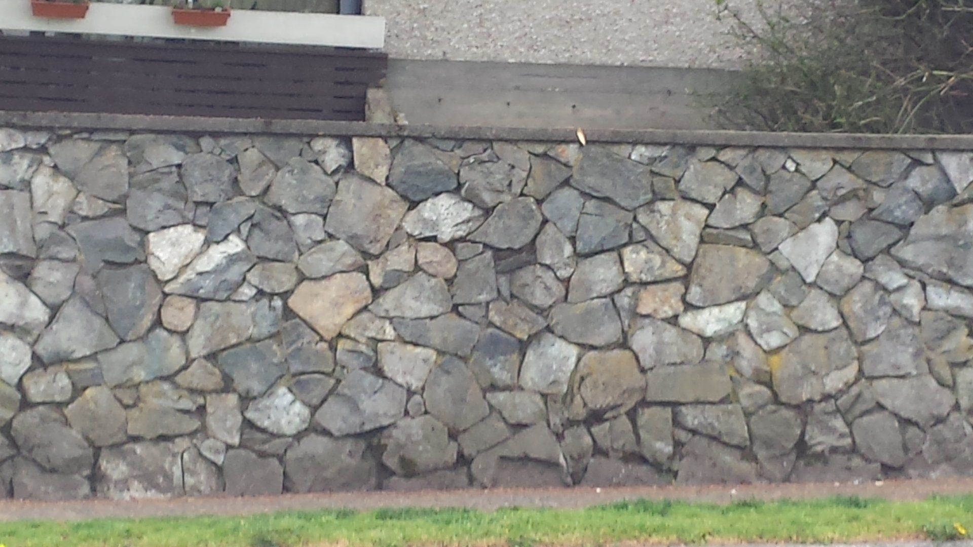 A 4 foot high stone retaining wall