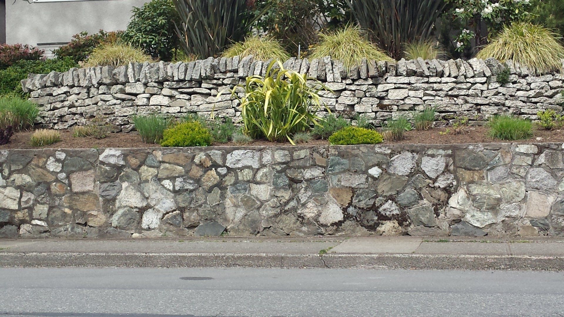 Ornamental short garden bed retaining wall