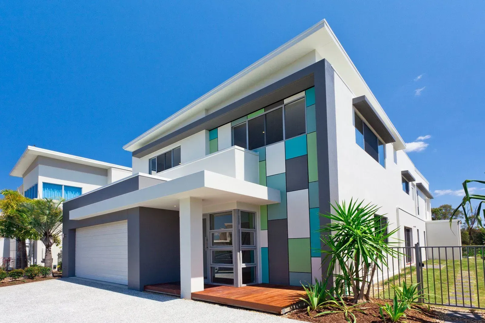 A modern house with a blue sky in the background